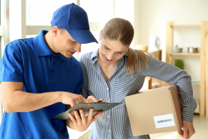 courier delivering package to a woman